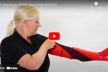 youtube thumbnail of lady wearing a black t shirt with one arm across her body reaching up her arm to grab on a dmo red and black glove