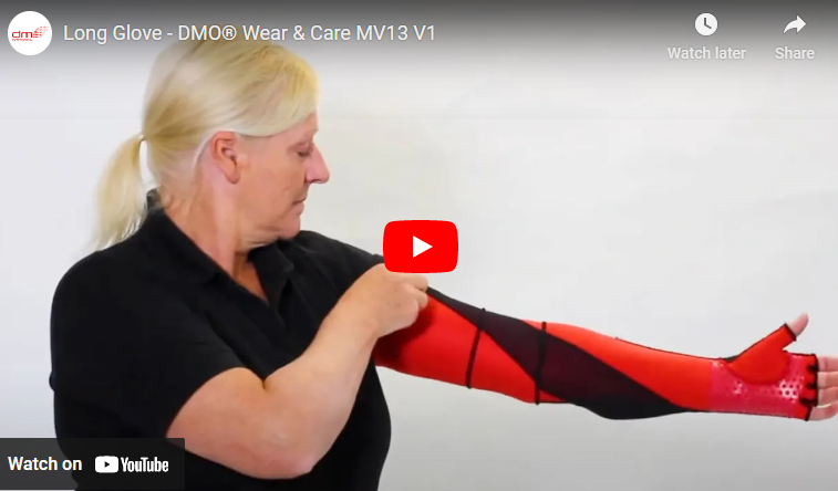 youtube thumbnail of lady wearing a black t shirt with one arm across her body reaching up her arm to grab on a dmo red and black glove